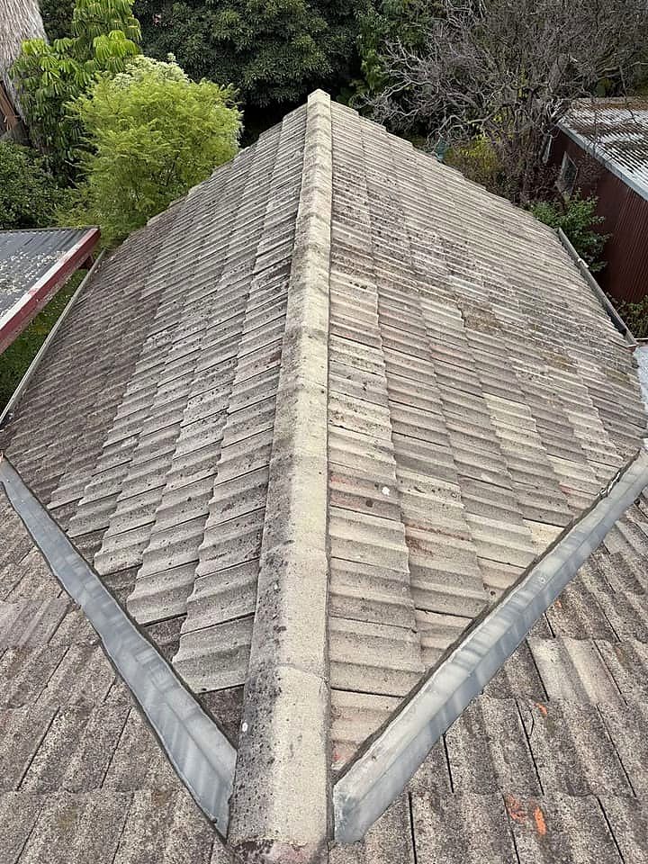 Hip line with cracked pointing photographed during a roof inspection